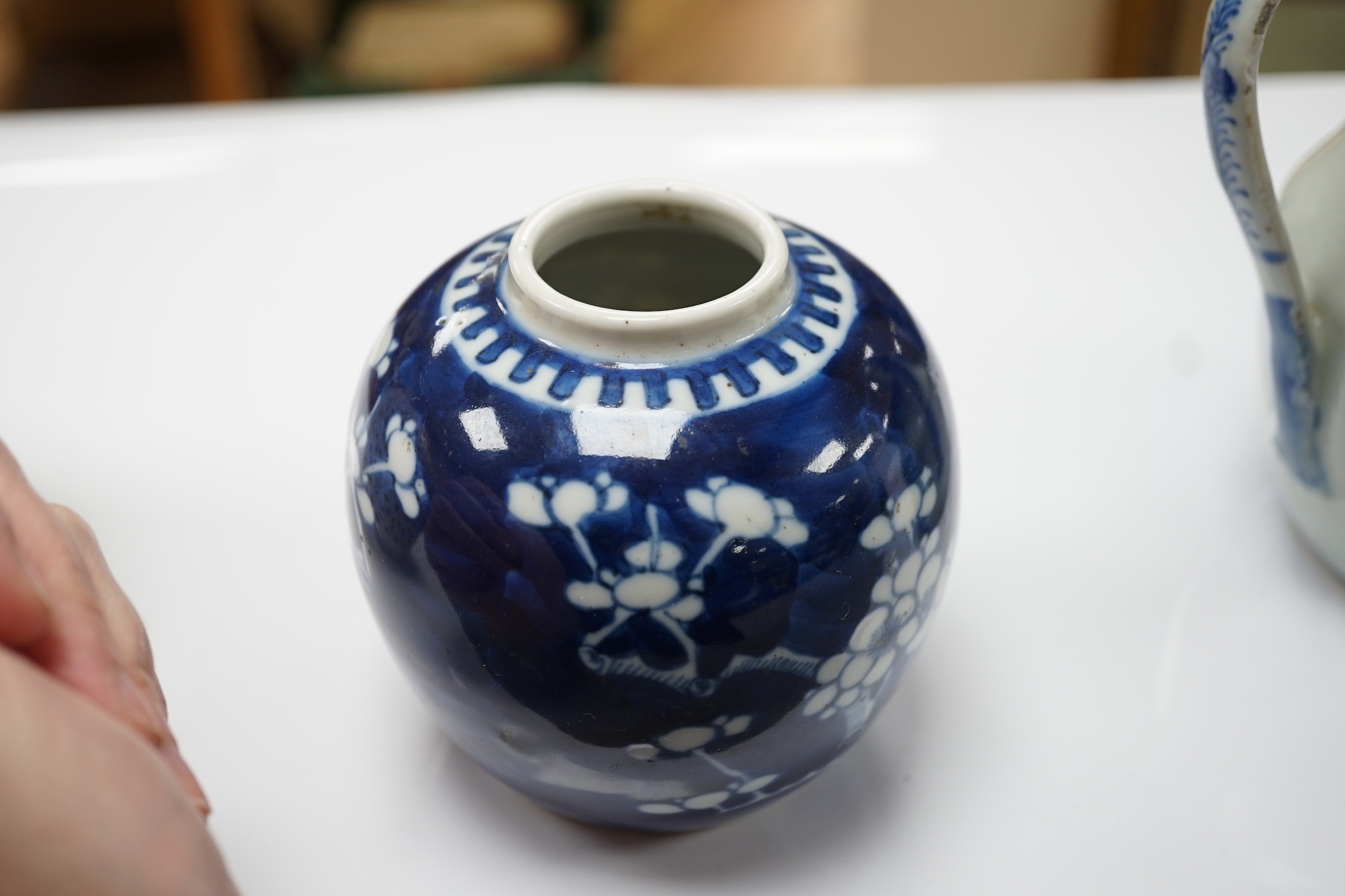 A 19th century Chinese blue and white jug, a similar jar and a pierced jar, tallest 15cm
